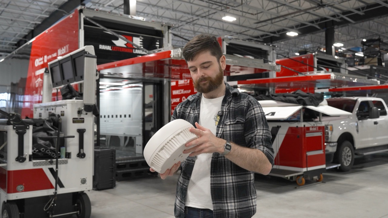 David working on a MAX antenna in front of an IndyCar engineering truck